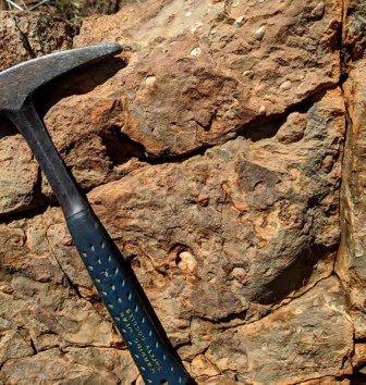 A picture containing rock, outdoor, mountain, sitting Description automatically generated